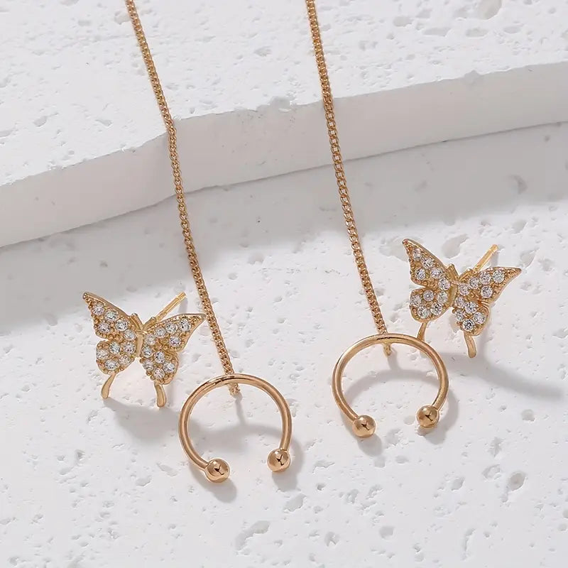 Elegant Golden-Tone Butterfly Ear Cuff with Sparkling Zirconia Stones and Tassel Accents